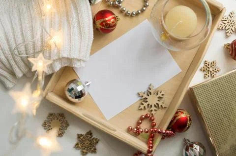 Composition of an empty white christmas card. Festive seasonal decorations, d Stock Photos
