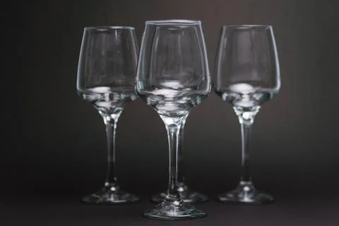 Composition with empty wine glasses on black background Stock Photos