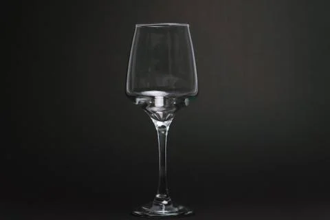 Composition with empty wine glasses on black background Stock Photos