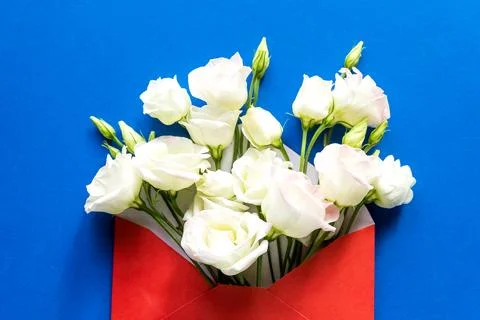 Composition with envelope and beautiful spring flowers.Spring invitation. Craft Stock Photos