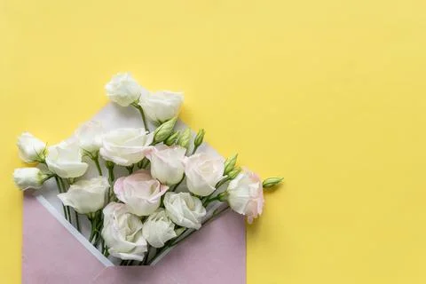 Composition with envelope and beautiful spring flowers.Spring invitation. Craft Stock Photos