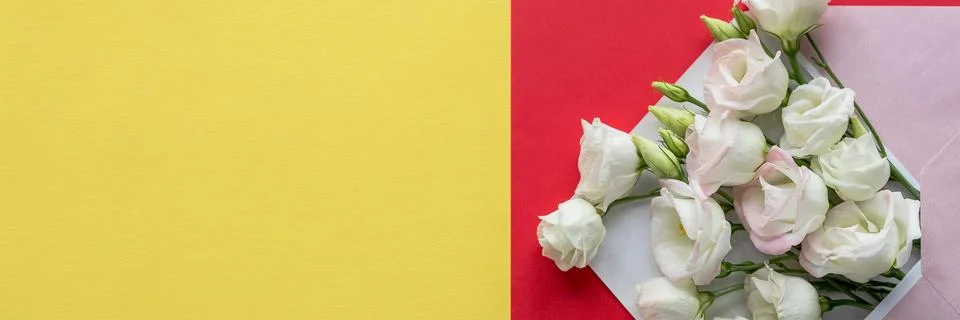 Composition with envelope and beautiful spring flowers.Spring invitation. Craft Stock Photos