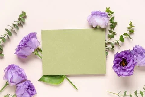 Composition with envelope and flowers on beige background, closeup Stock Photos