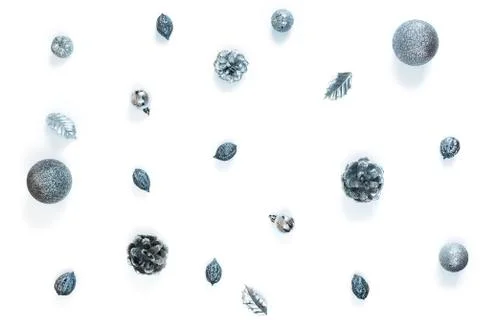 Composition flat lay Christmas decor silver cones nuts balls isolated on whit Stock Photos