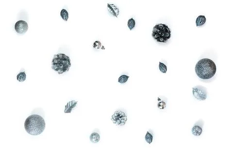 Composition flat lay Christmas decor silver cones nuts balls isolated on whit Stock Photos