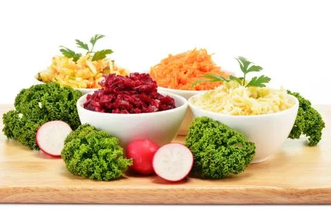 Composition with four vegetable salad bowls Foto stock