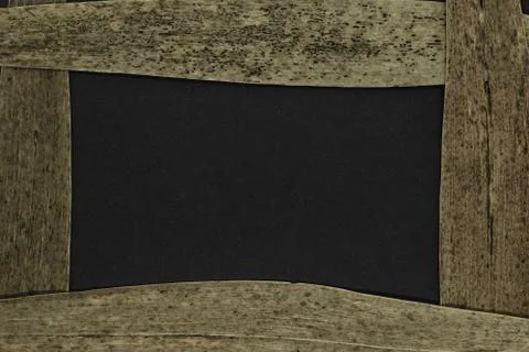 Composition of frame from dry brown reed leaves and black area in the center 库存照片
