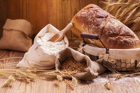 Composition of fresh bread, cereals and grains. Stock Photos