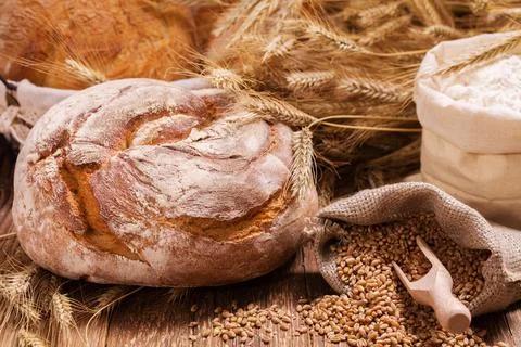 Composition of fresh bread cereals and grains Stock Photos