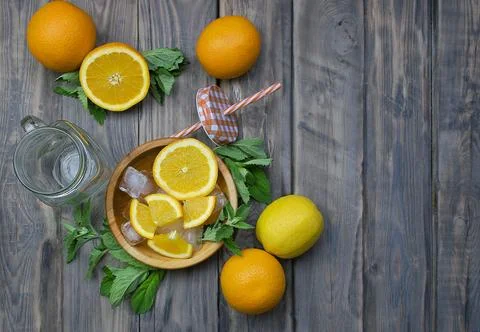 Composition with fresh orange , mint, lemons  closeup. Fresh natural drink .. Stock Photos