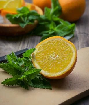 Composition with fresh orange , mint, lemons  closeup. Fresh natural drink .. Stock-Fotos