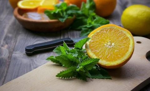 Composition with fresh orange , mint, lemons  closeup. Fresh natural drink .. Foto stock