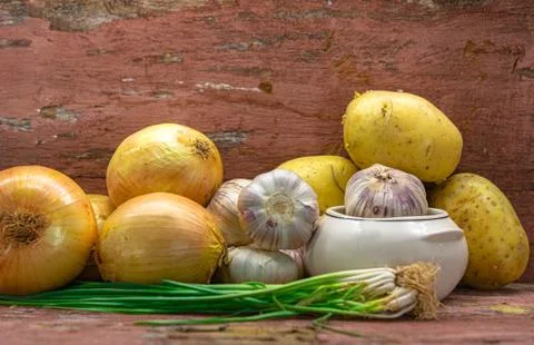 Composition of fresh vegetables on aged wooden background Stock Photos