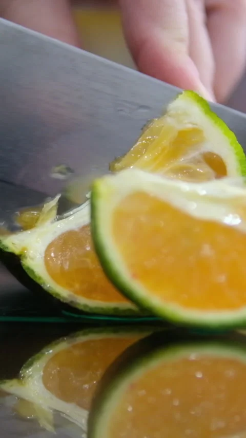 Composition of fresh Vietnamese oranges and leaves on a glass table. Cut the Stock Footage 276442141
