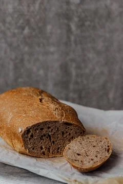 Composition of freshly baked bread on old wooden background Stock Photos