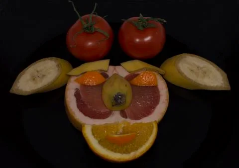 Composition from fruit in the form of a muzzle Stock Photos