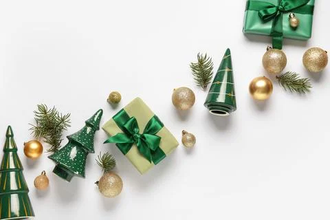 Composition with gift boxes and golden Christmas balls on white background Stock Photos