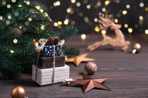 Composition with gift boxes, Christmas decorations, pine and lights bokeh Stock Photos