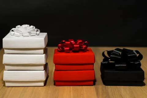 Composition of gift boxes. On the left are three white boxes with a white bow 스톡 사진