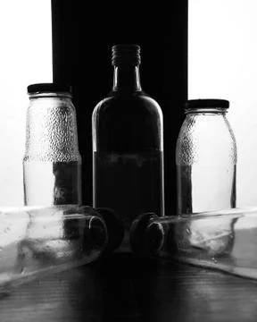 Composition of glass bottles on a light background Stock Photos