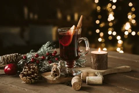 Composition with a glass of hot mulled red wine with spices. Holiday atmosphere Stock Photos