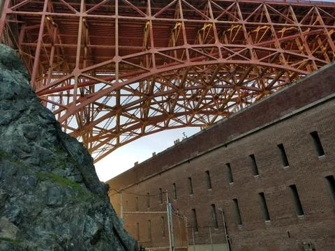 Composition with Golden Gate Bridge, Fort Point and nearby rock formation Stock Photos