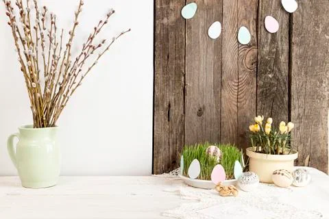 Composition for greeting card: Easter eggs, willow branch, grass, crocus Stock Photos