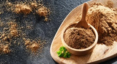 Composition with ground coriander, its dried seeds and fresh leaves Stock Photos