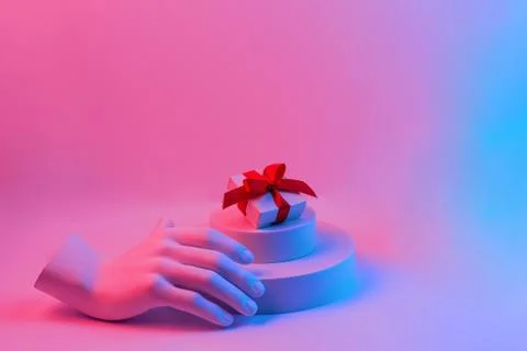 Composition with gypsum hand. A box with a red ribbon on the podium. Gift con Stock Illustration