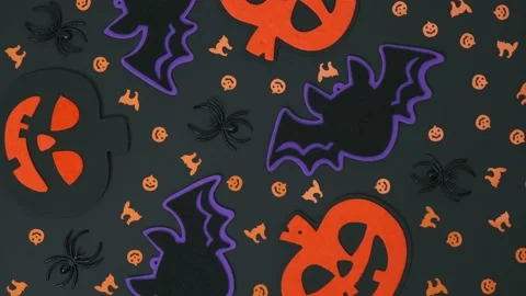 Composition of Halloween creative decorations rotate on an black background. 4k. Stock Footage 205177086