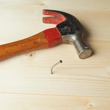 Composition of hammer and nail Stock Photos
