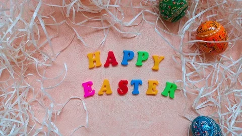 Composition with "Happy Easter" words, Easter eggs and straw. Stock Footage 103851149