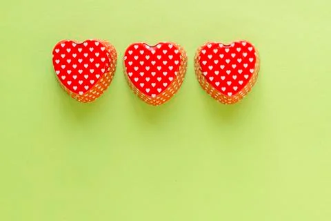 Composition of heart shape valentine cupcake metallic container Stock Photos