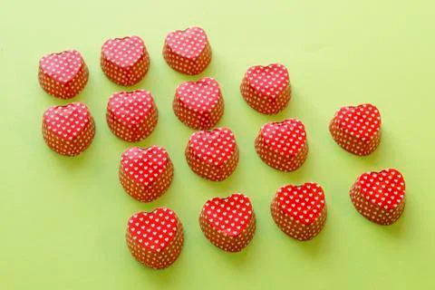 Composition of heart shape valentine cupcake metallic container Stock Photos