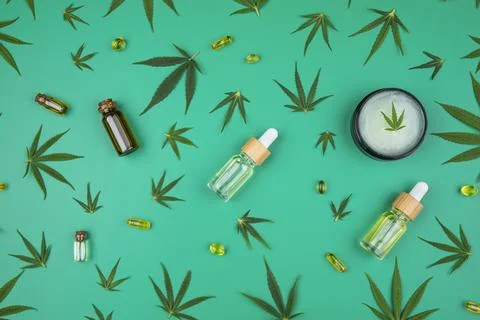 Composition with hemp oil cbd and bottle of oil on green background Stock Photos