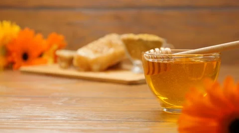 Composition of honey, honeycomb, bee bread and flowers. Changing focus (No 10.1) Stock Footage 67150474