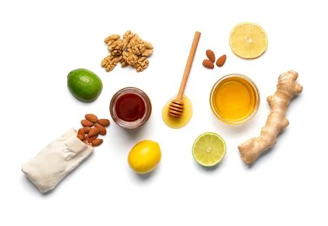 Composition of honey in a jars, lemon, lime, ginger isolated. Stock Photos