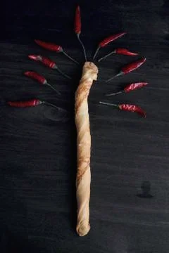 Composition of hot pepper and bread in the form of wood Stock Photos