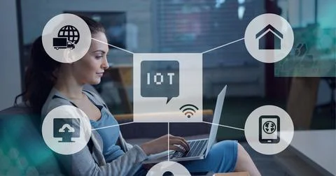 Composition of iot icon with network of connections over woman using laptop 스톡 사진
