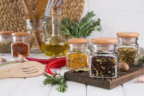 Composition of kitchen tools, spices and herbs on white table Stock Photos