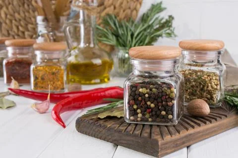 Composition of kitchen tools, spices and herbs on white table Stock Photos