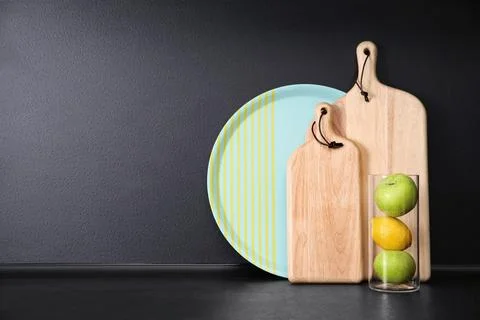 Composition with kitchenware and fruits on table against grey background. Spa Stock Photos