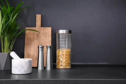 Composition with kitchenware on table against grey background. Space for text Stock Photos