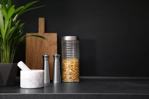 Composition with kitchenware on table against grey background. Space for text Stock Photos