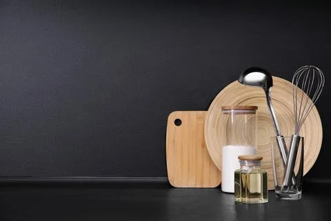 Composition with kitchenware on table against grey background. Space for text Stock Photos