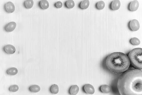 Composition of kiwi and grape Stock Photos