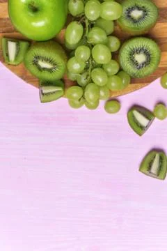 Composition of kiwi, grape and apple Stock Photos