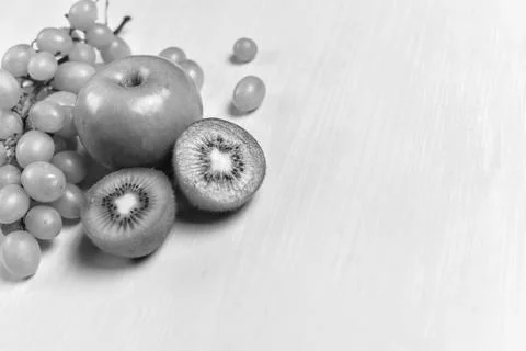 Composition of kiwi, grape and apple Stock Photos
