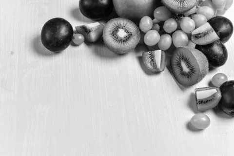 Composition of kiwi, grape and apple Stock Photos