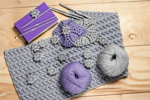 Composition of knitting accessories and needlework elements. Grey and purple  Foto stock